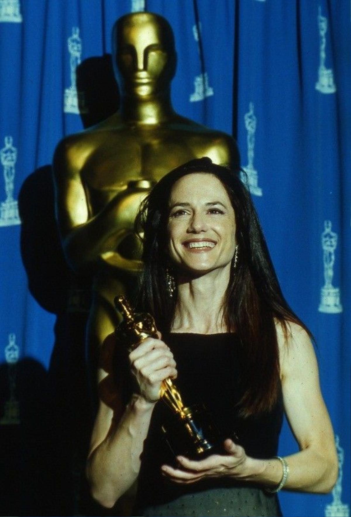 American actress Holly Hunter poses with her trophy, after she was awarded with the Oscar as best actress for her lead role in the Jane Campion's film "The Piano" at 66th annual Acedemy Awards, in Los Angeles, USA, March 21, 1994. (AP Photo/Lois Bernstein)