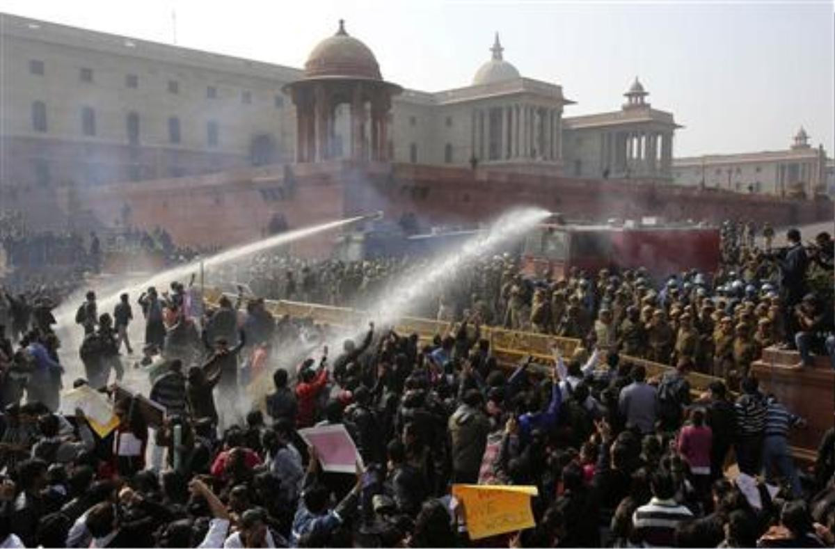 Police use water cannons to disperse demonstrators near the presidential palace during a protest rally in New Delhi December 22, 2012. Indian police used batons, tear gas and water cannon to turn back thousands of people marching on the presidential palace on Saturday in intensifying protests against the gang-rape of a woman on the streets and on social media. REUTERS/Adnan Abidi